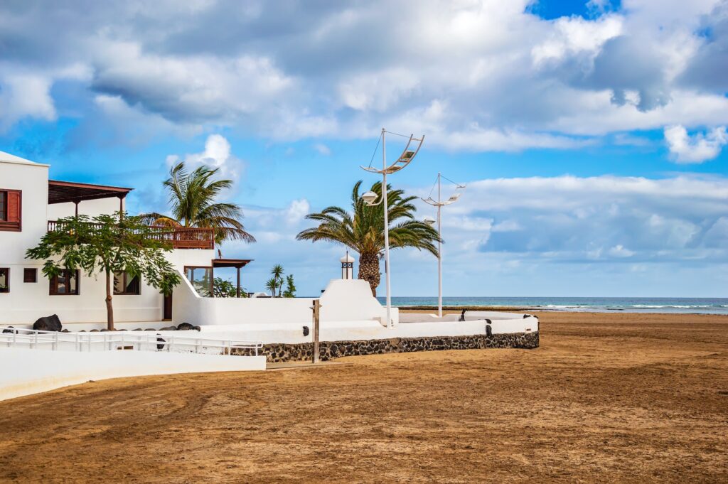 Typical white houses on beach of Playa Honda on Lanzarote island, Spain